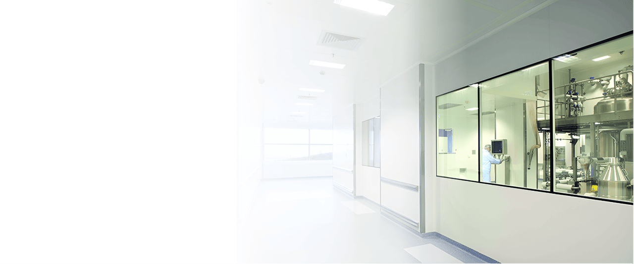 Cleanroom corridor with a glazed window onto a process area