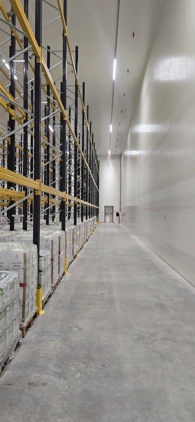 Cold store aisle with pallet racking along one side